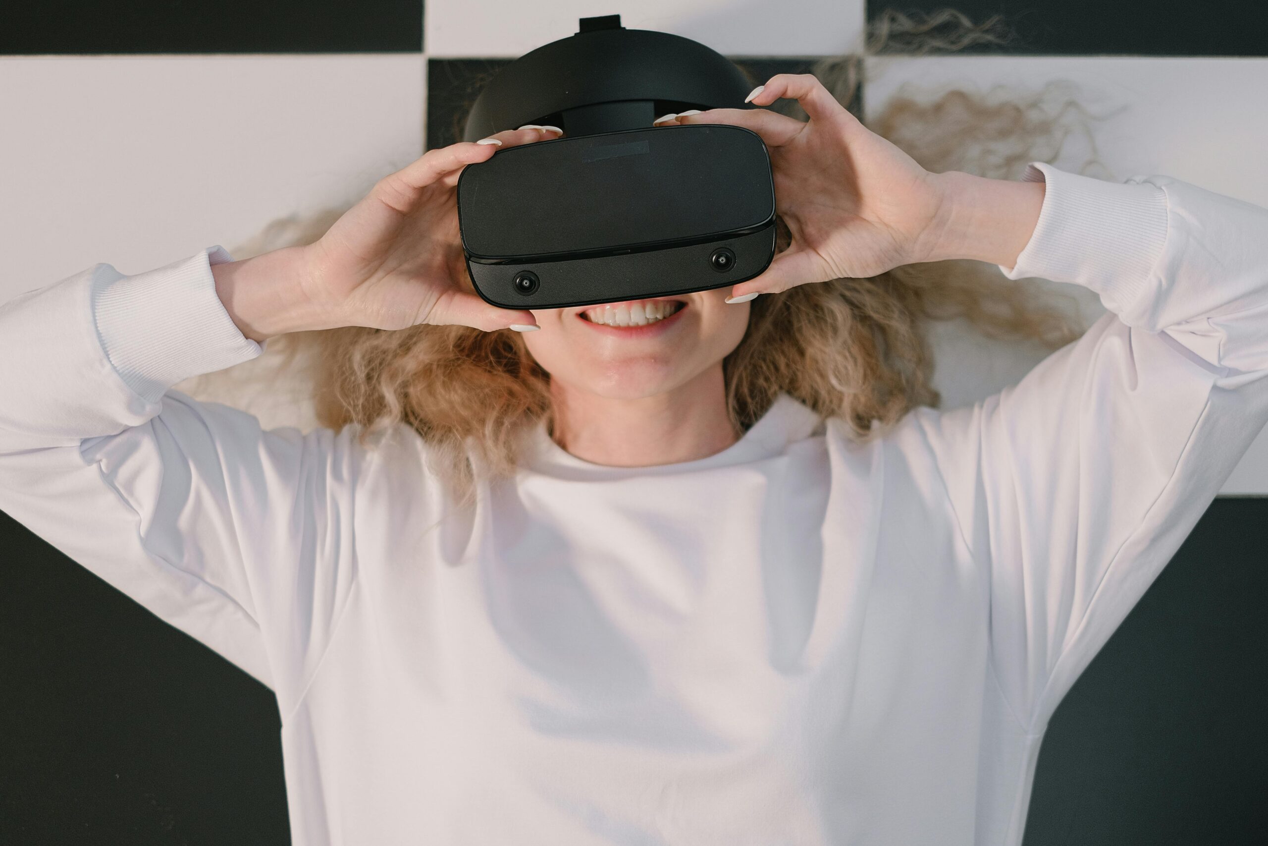 A Woman Lying Down with a Virtual Reality Headset